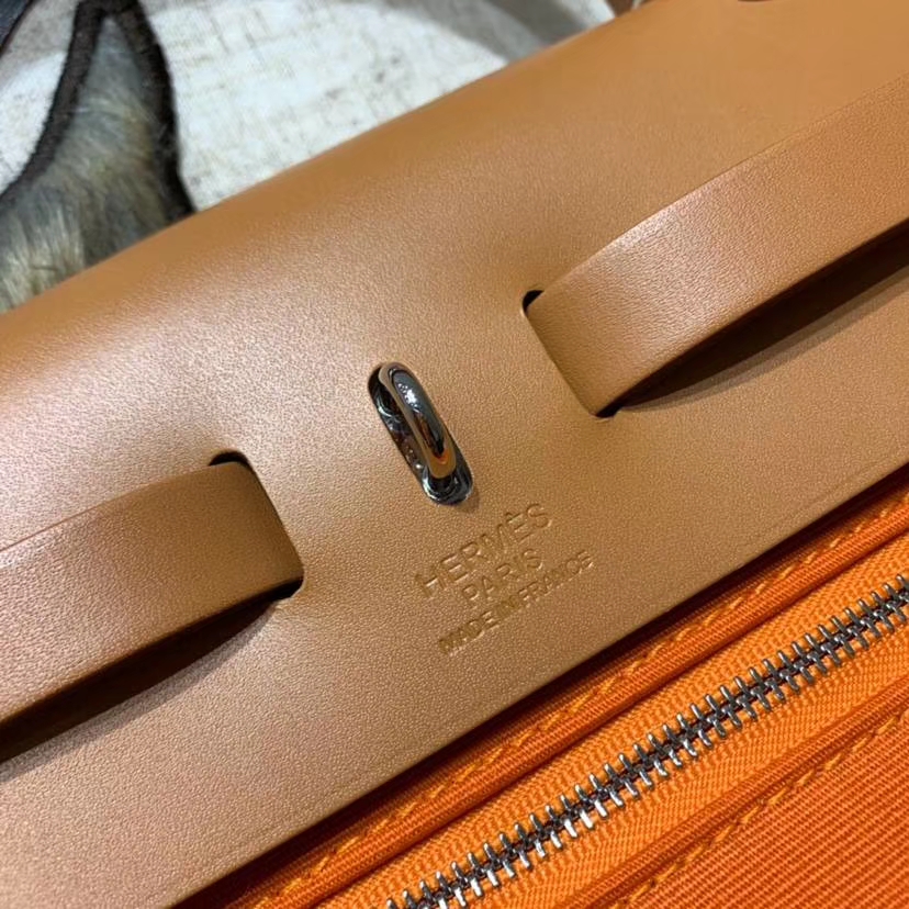 爱马仕新款女包 Hermes Herbag31CM 橙色帆布拼马鞍皮手提单肩包 银扣